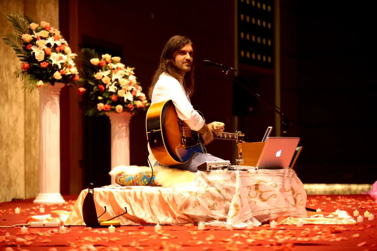 Concert performance with ornate stage and rose petals