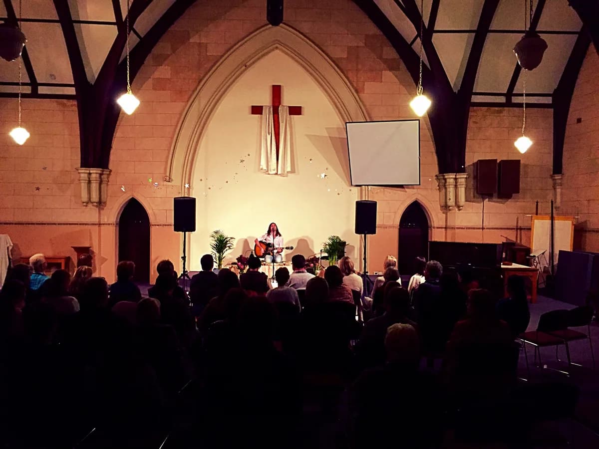 Performing in historic church with Gothic arches